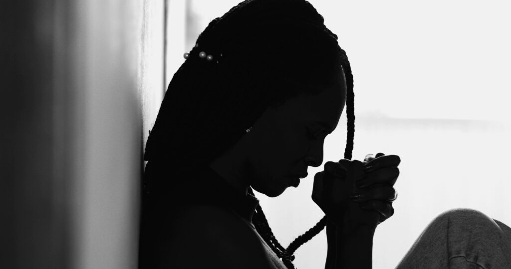 Profile of woman praying